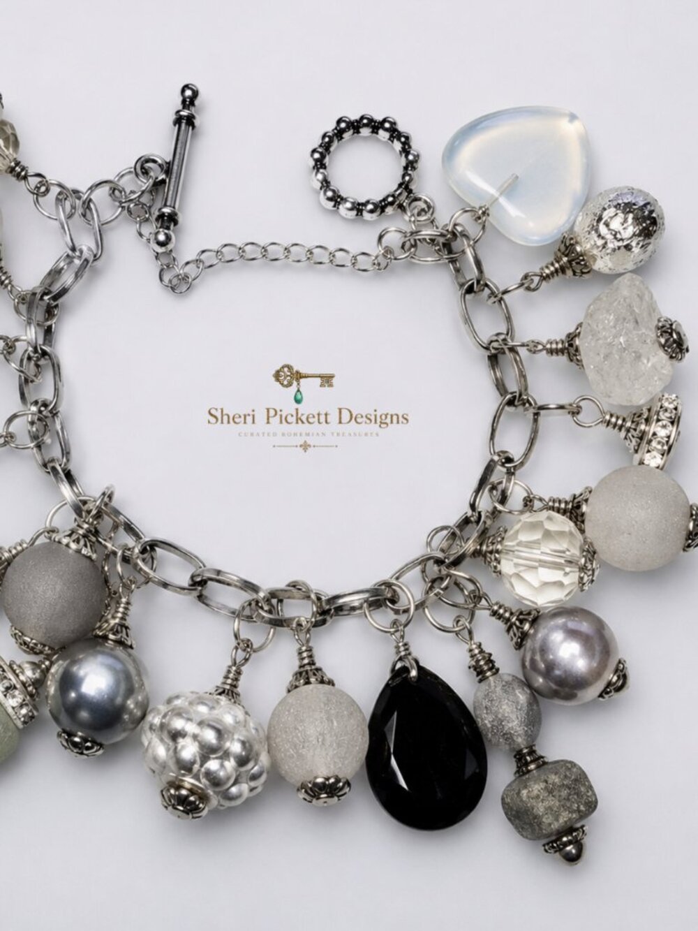 Silver and smoke charm bracelet